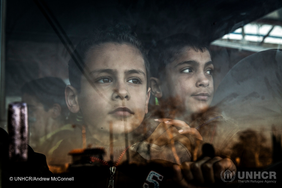 Mohammed Adlani, 8 (left), and Mohammed Chami, 11, take a bus to school from the Islamic Charity Association Orphanage in Homs, Syria. Mohammed Adlani’s father died and his mother has disappeared, he lives in the orphanage with his 3 brothers. Mohammed Chami’s mother died and he lives in the orphanage with his 2 sisters and one brother because his father is unable to take care of them due to the conflict. 