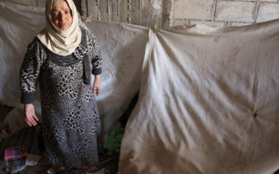 Burning trash to keep warm in Syrian cut off town