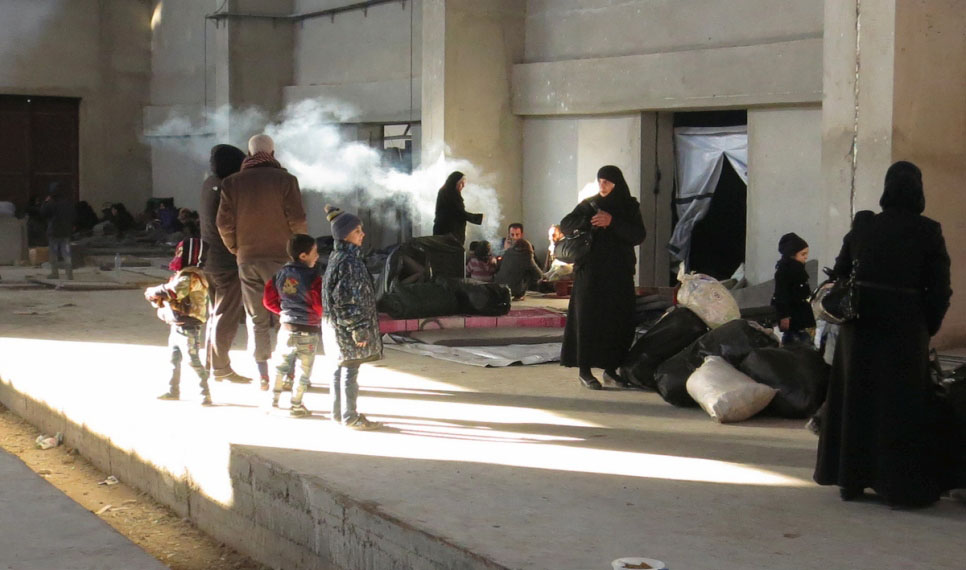 Newly displaced families from east Aleppo reach reach a shelter in Mahalej, Syria. © UNHCR/Mohamed Jertila