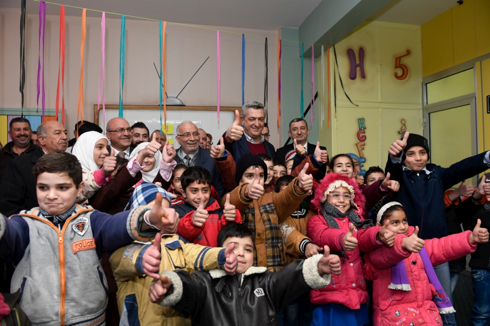 UN High Commissioner for Refugees Filippo Grandi pictured with displaced children in one of UNHCR Community Centers in Al-Midan neighborhood, Homs, Syria. © UNHCR/Bassam Diab