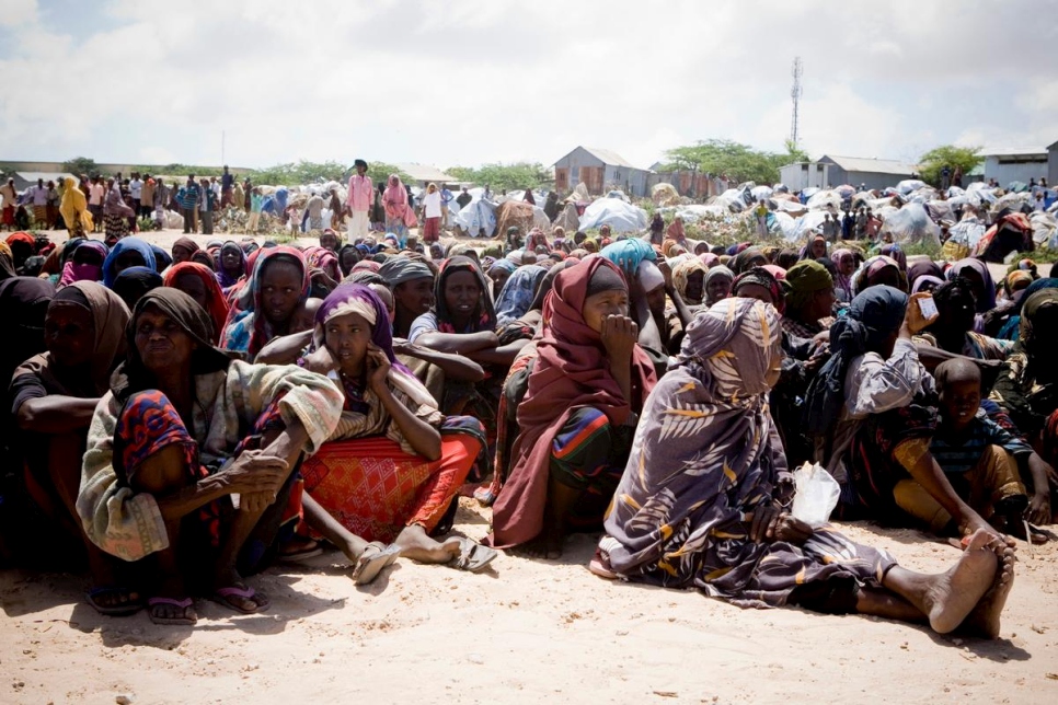 Somali women displaced by drought and famine wait in line to collect UNHCR aid supplies at the Maajo IDP settlement in Mogadishu, Somalia in this 2011 file photo. © UNHCR/Siegfried Modola