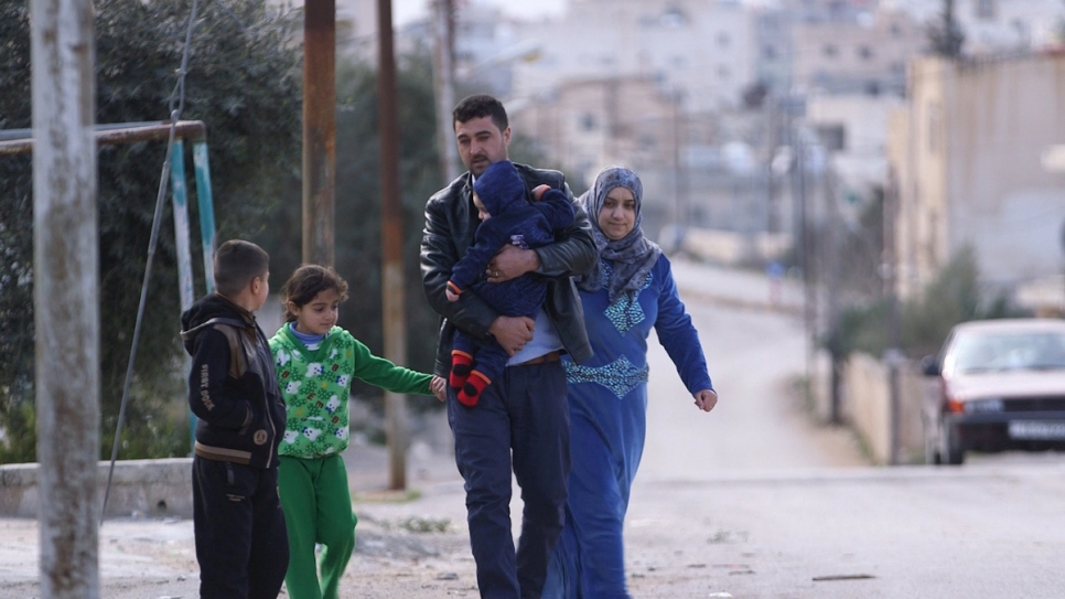 Firas and his family walk through Irbid, Jordan, for the last time before beginning a new life in the US. © UNHCR/Houssam Hariri