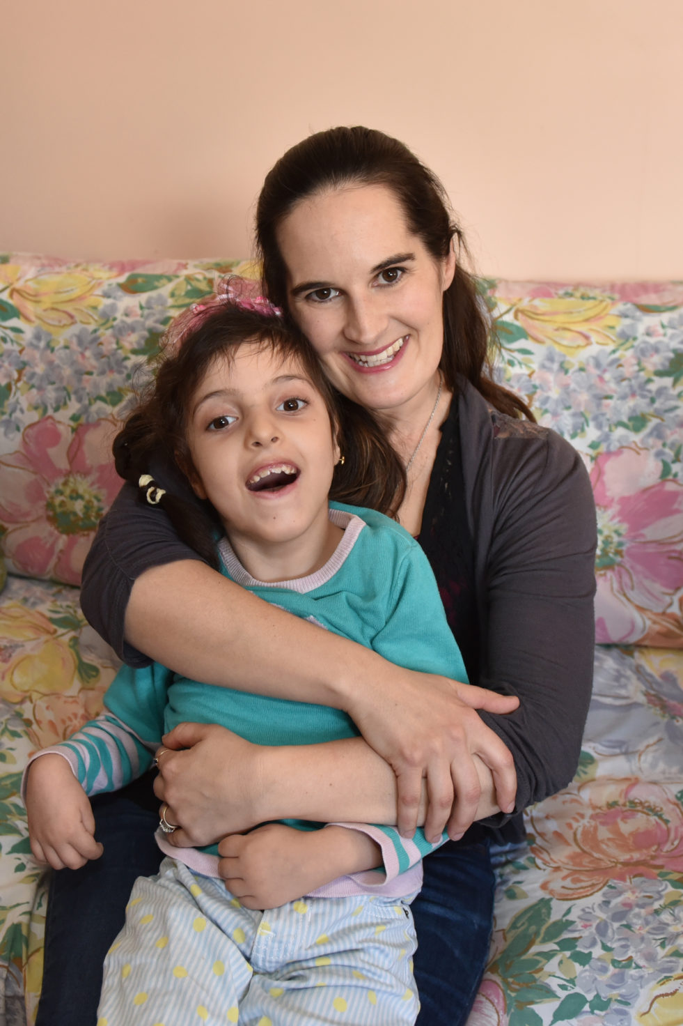 Head volunteer, Miranda O’Leary, loves spending time with Barraa, the youngest daughter of the Alrajab family. © Courtesy of Miranda O’Leary Photography