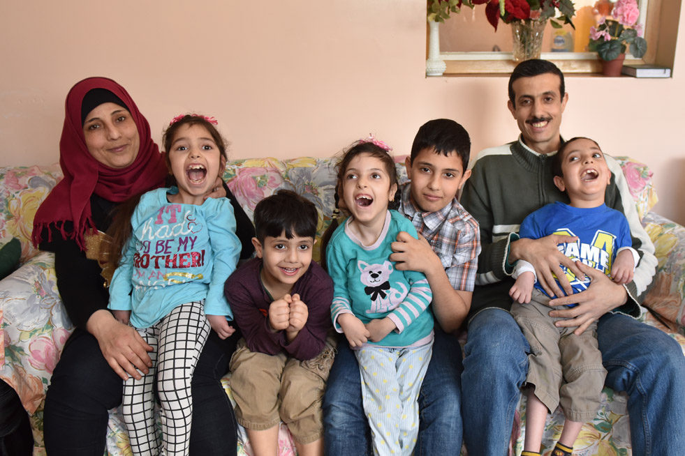 The Alrajab family enjoying their home in Saint John, New Brunswick. From left to right: Mother Shamsa; Sarah, 11; Muhammed, 5; Barraa, 7; Adnan, 12; Abdullah, 9 and Father Nasser. © Courtesy of Miranda O’Leary Photography