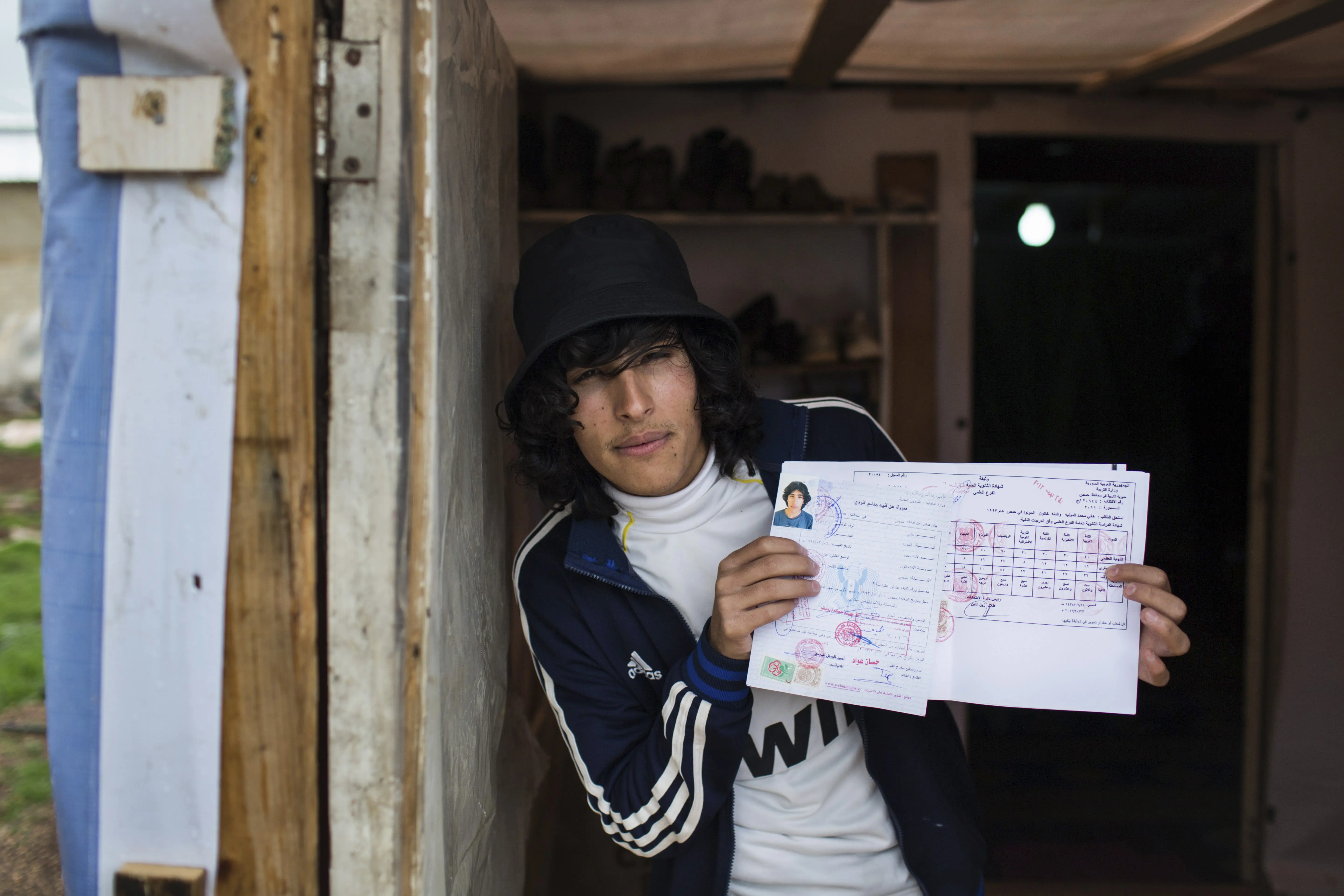 Hany pictured outside his shelter at a tented settlement in the Bekaa Valley, Lebanon, on 12 March 2014. 