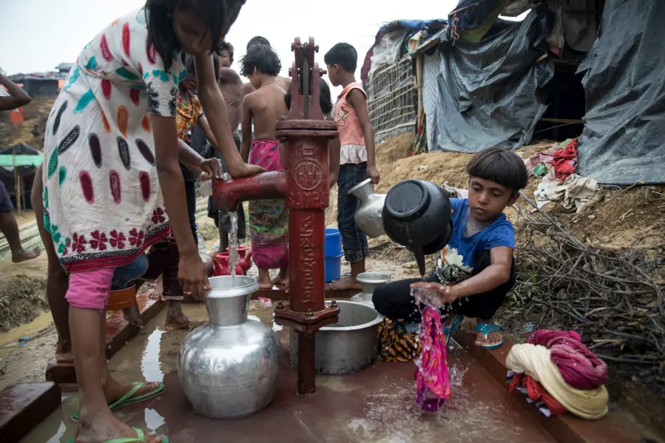 With Balukhali refugee camp and other settlements growing on a daily basis, access to clean water is restricted to these water wells. © UNHCR/Paula Bronstein