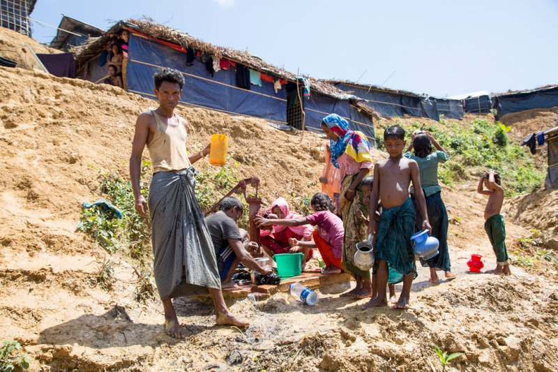 Rohingya refugee, Anu Mia (left), age 30, struggles to get clean water and sanitation in Kutupalong Refugee Camp Extension. © UNHCR/Roger Arnold