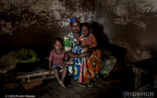 After five months of hiding in the bush, Marie returned home to find the family business in ruins. © UNHCR/John Wessels