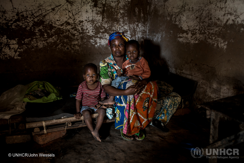 After five months of hiding in the bush, Marie returned home to find the family business in ruins. © UNHCR/John Wessels