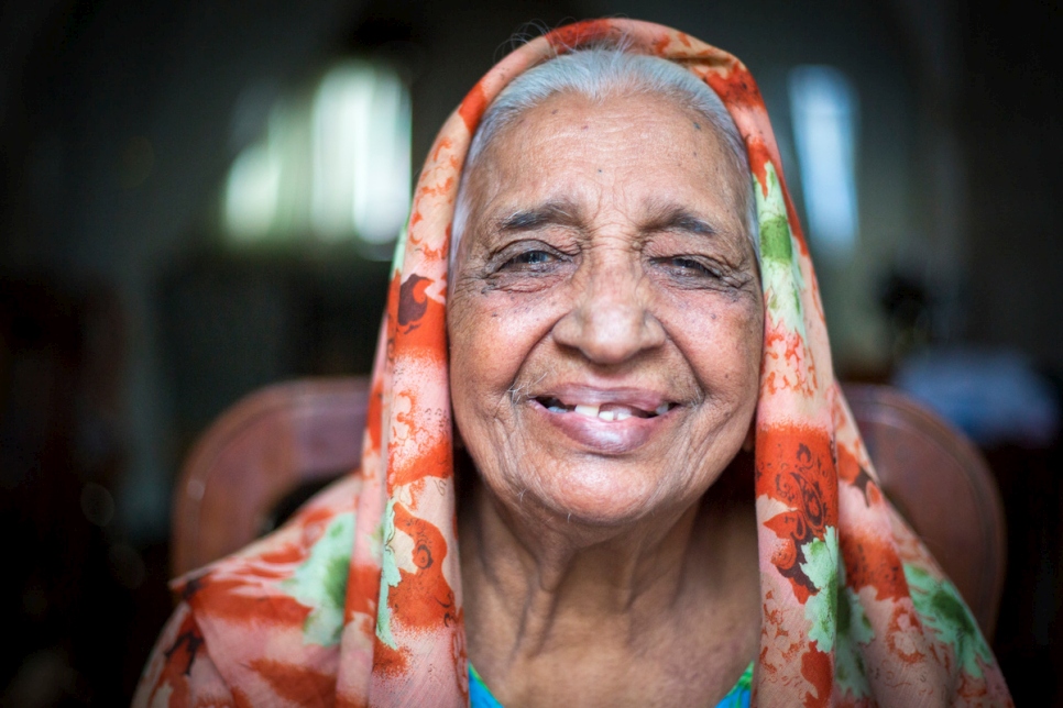 Sougrabay Ibrahim, an 84-year-old Karana, from Madagascar, poses for a portrait with her grandchildren while attending a UNHCR stateless workshop. © UNHCR/Roger Arnold