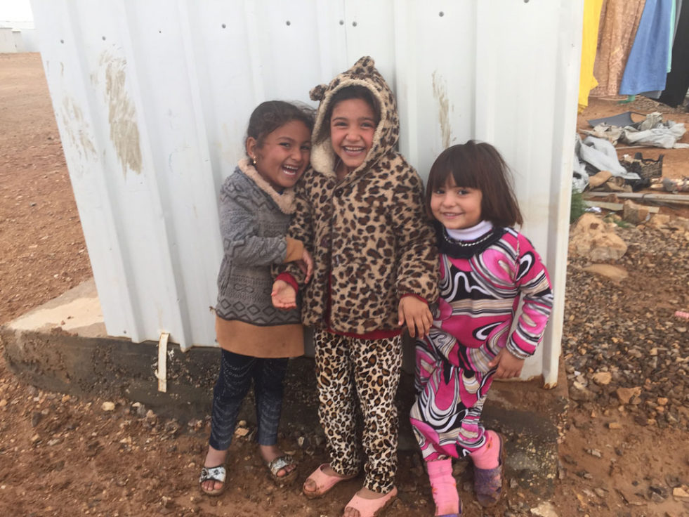 Five -year-old Rajaa (left) shares a laugh with her friends at Azraq Camp in Jordan. ©UNHCR/Lauren La Rose 