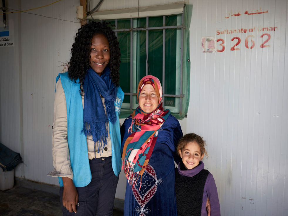 UNHCR Canada Senior Fundraising Communications Associate Lauren La Rose (left) meetes with Syrian refugee Zeenab (centre) and her daughter Rahaf, 7, at their shelter at Zataari Camp in Jordan. ©UNHCR/David Azia