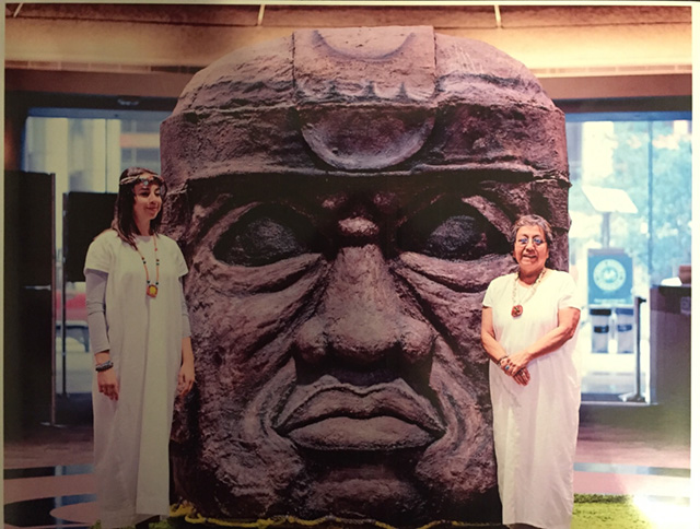 Karina (left) and fellow artist Maria (right) stand beside their sculpture of a Mexican God, which was chosen for display at Toronto’s City Hall. ©Photo courtesy of Karina