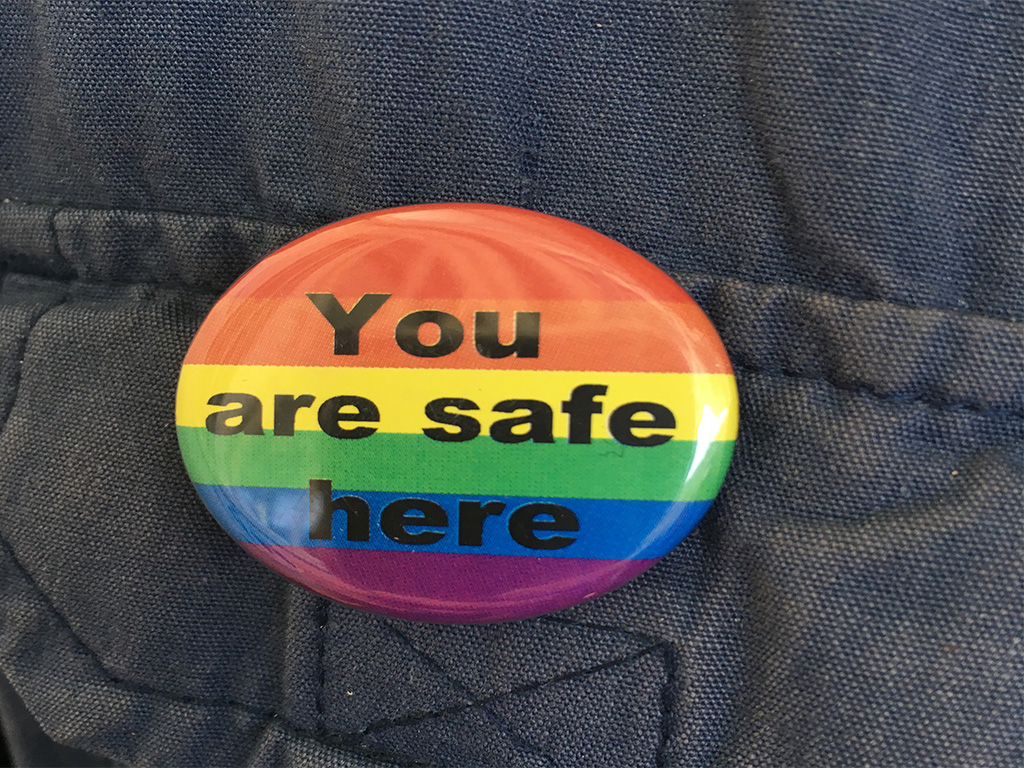 UNHCR staff member Aoife in Amman’s refugee registration centre wears a button, “You are safe here,” letting LGBTQ refugees know who to seek help from. UNHCR work to support vulnerable LGBTQ refugees seeking help across the world. Mandatory photo credit: © UNHCR/Jaz Cummins