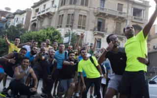 Group or men taking a group selfie after running a marathon