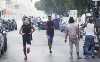 Two men running on the streets in a marathon