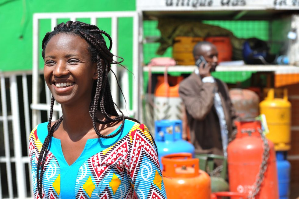 A portrait of a smiling woman who is a clean energy entrepreneur