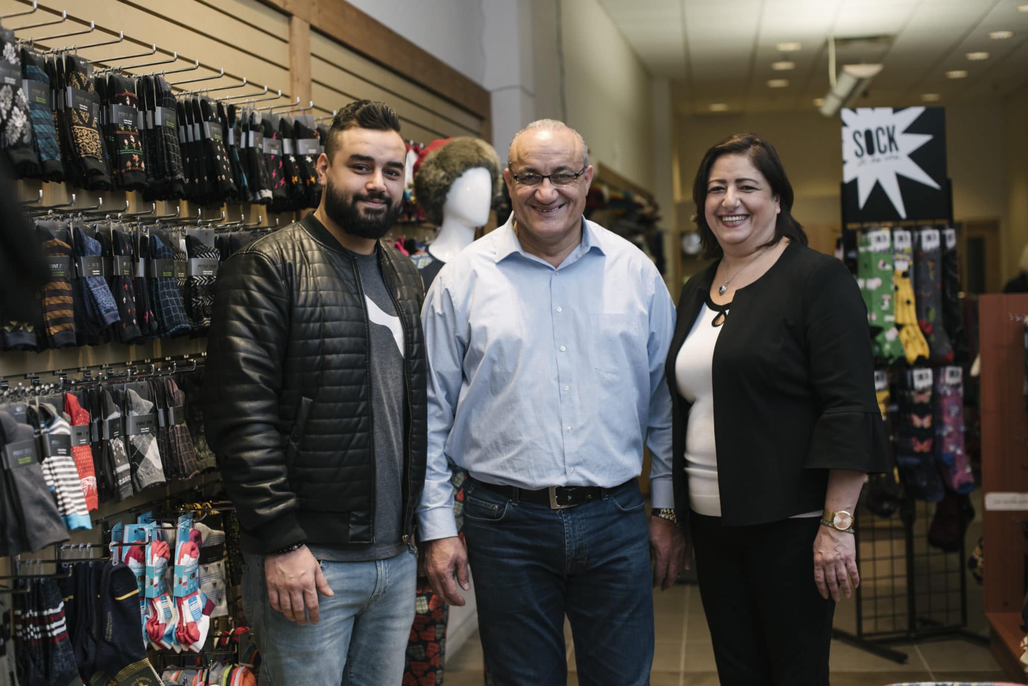A refugee family from Syria stands in their store in Guelph