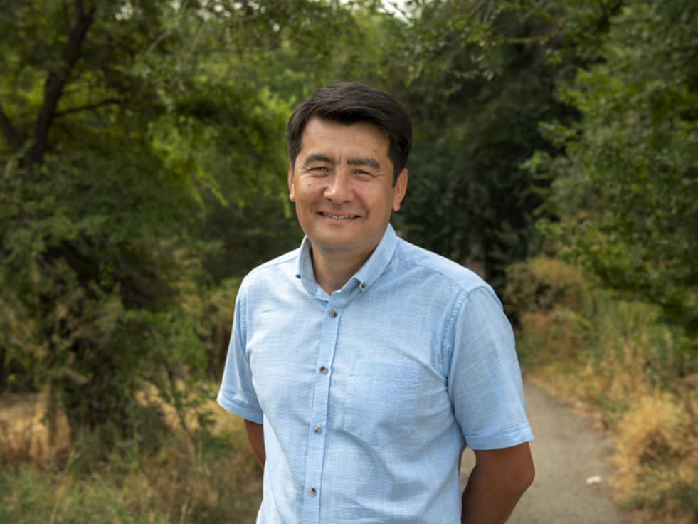 Nansen award winnder Azizbek Ashurov stands on a trail in Kyrgyzstan