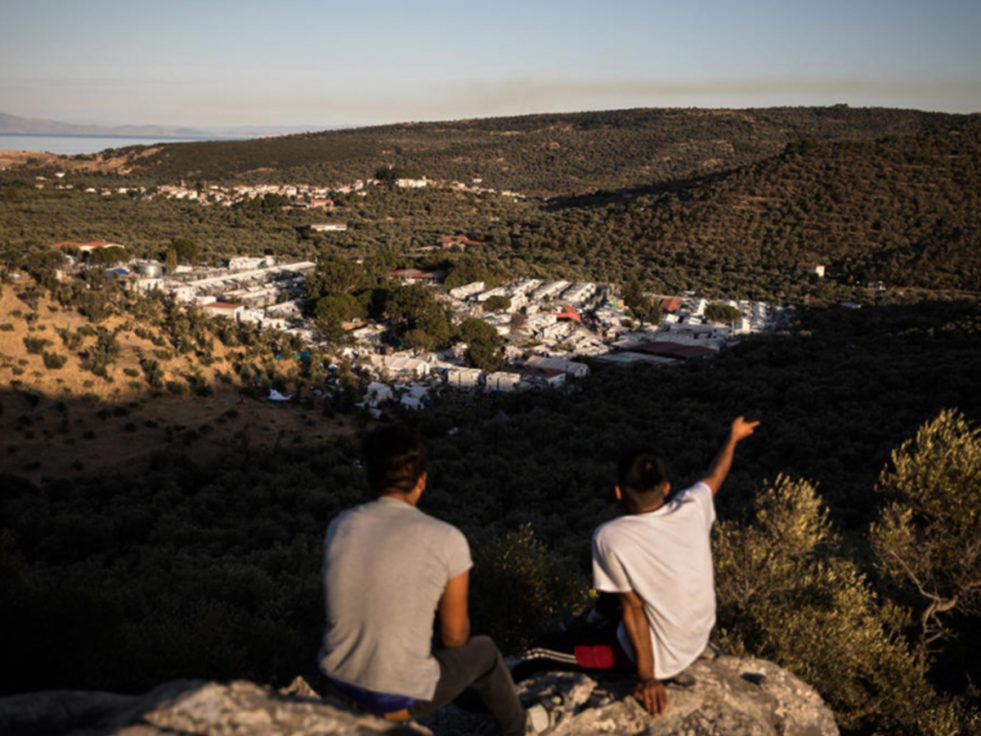 Two boys sit on Lesvos island