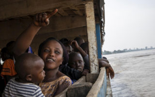 Central African refugees sit on a boat