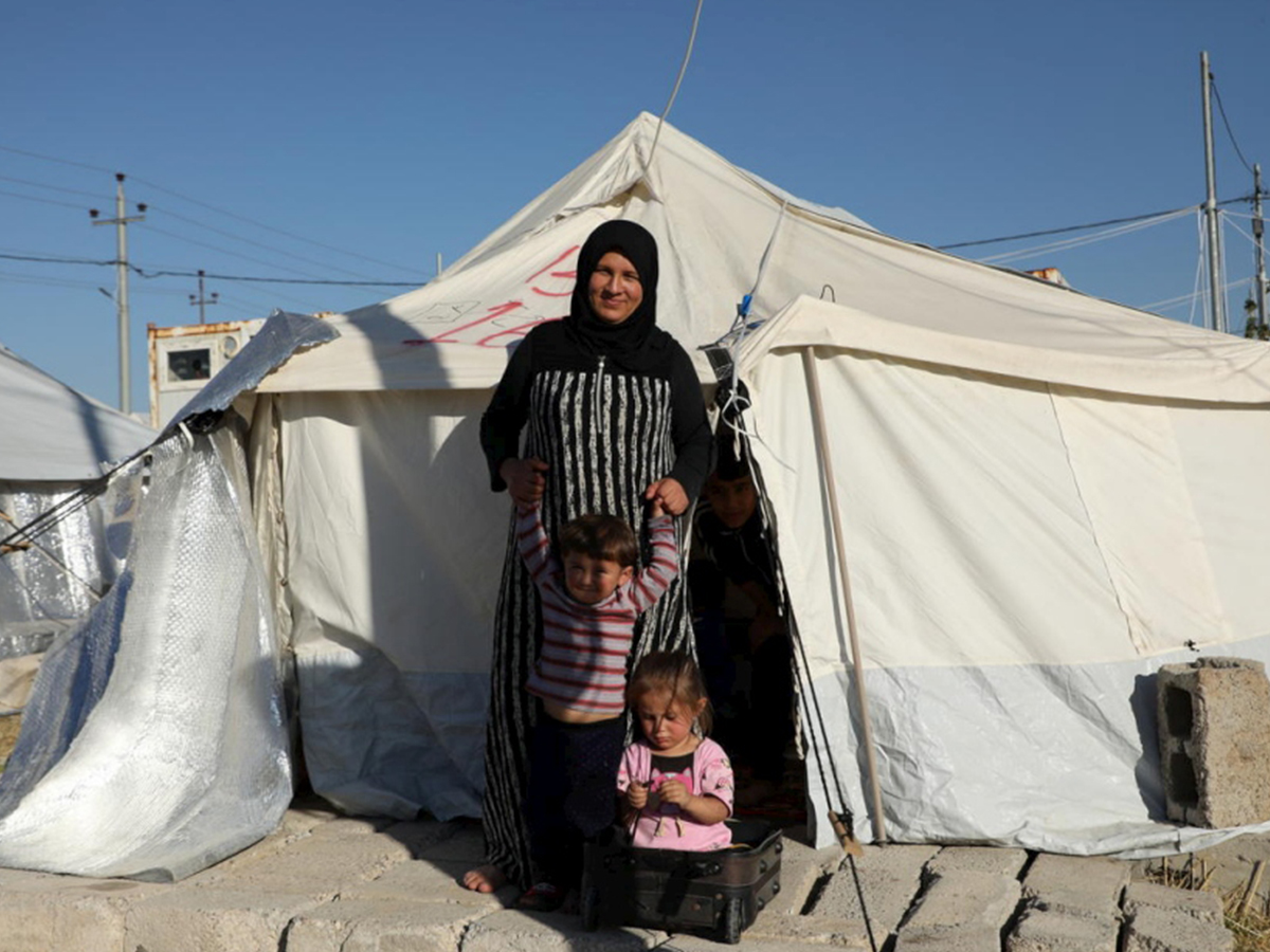 A Syrian refugee and her family prepares for winter