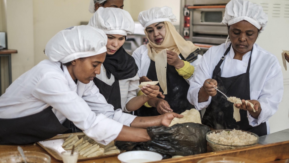 A group of people cook