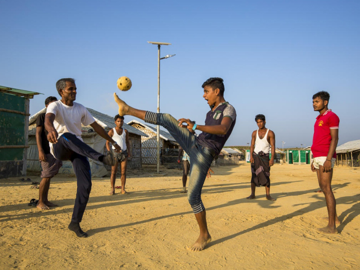 Young boys play soccer