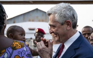 UN High Commissioner for Refugees Filippo Grandi talks to returning refugees in Bangui, the Central African Republic