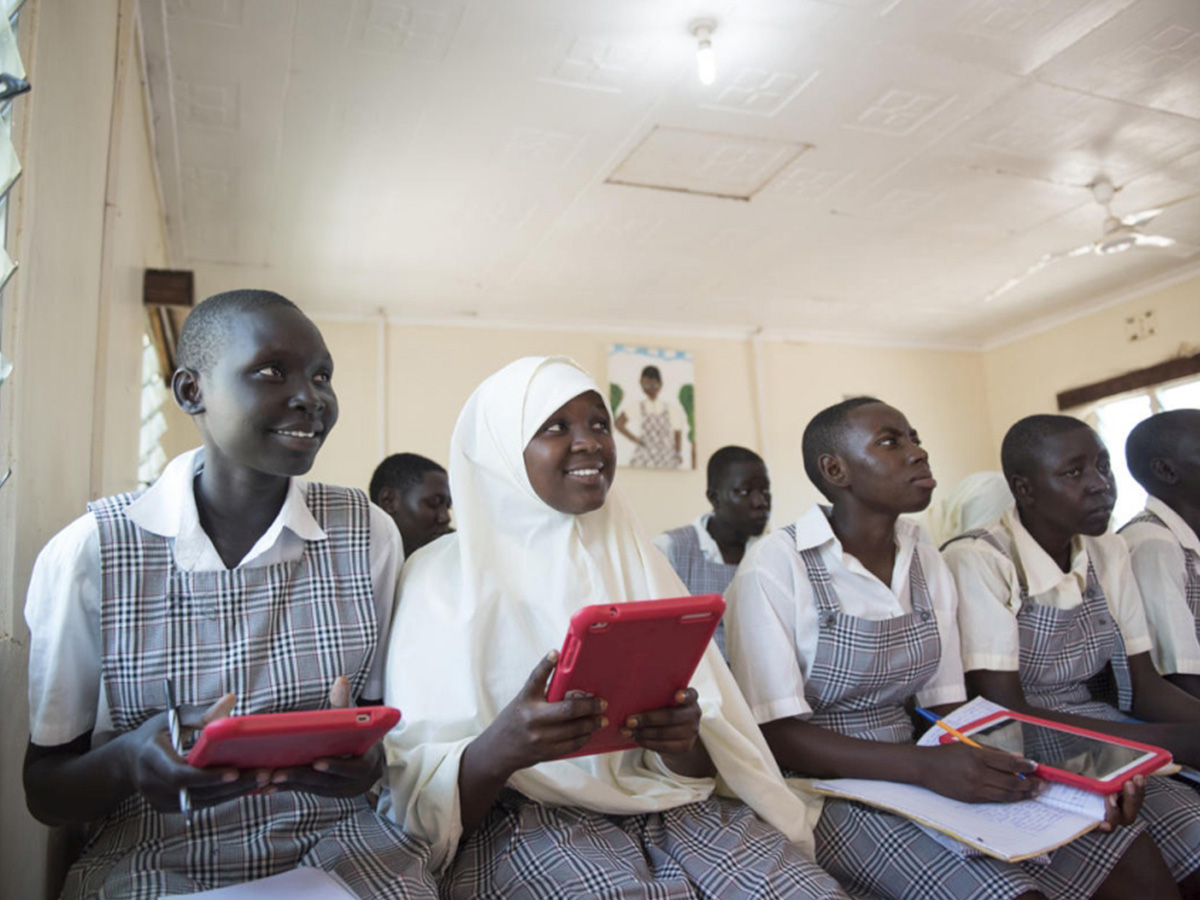 Girls sit in a school