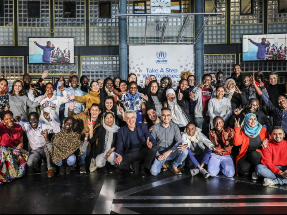 High Commissioner of UNHCR pose with refugees in Geneva