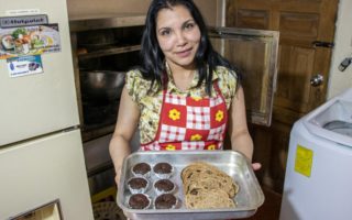 Refugee holds vegan desert she baked