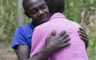 Refugees from South Sudan hug each other