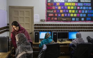 Women attend a computer lab in Pakistan