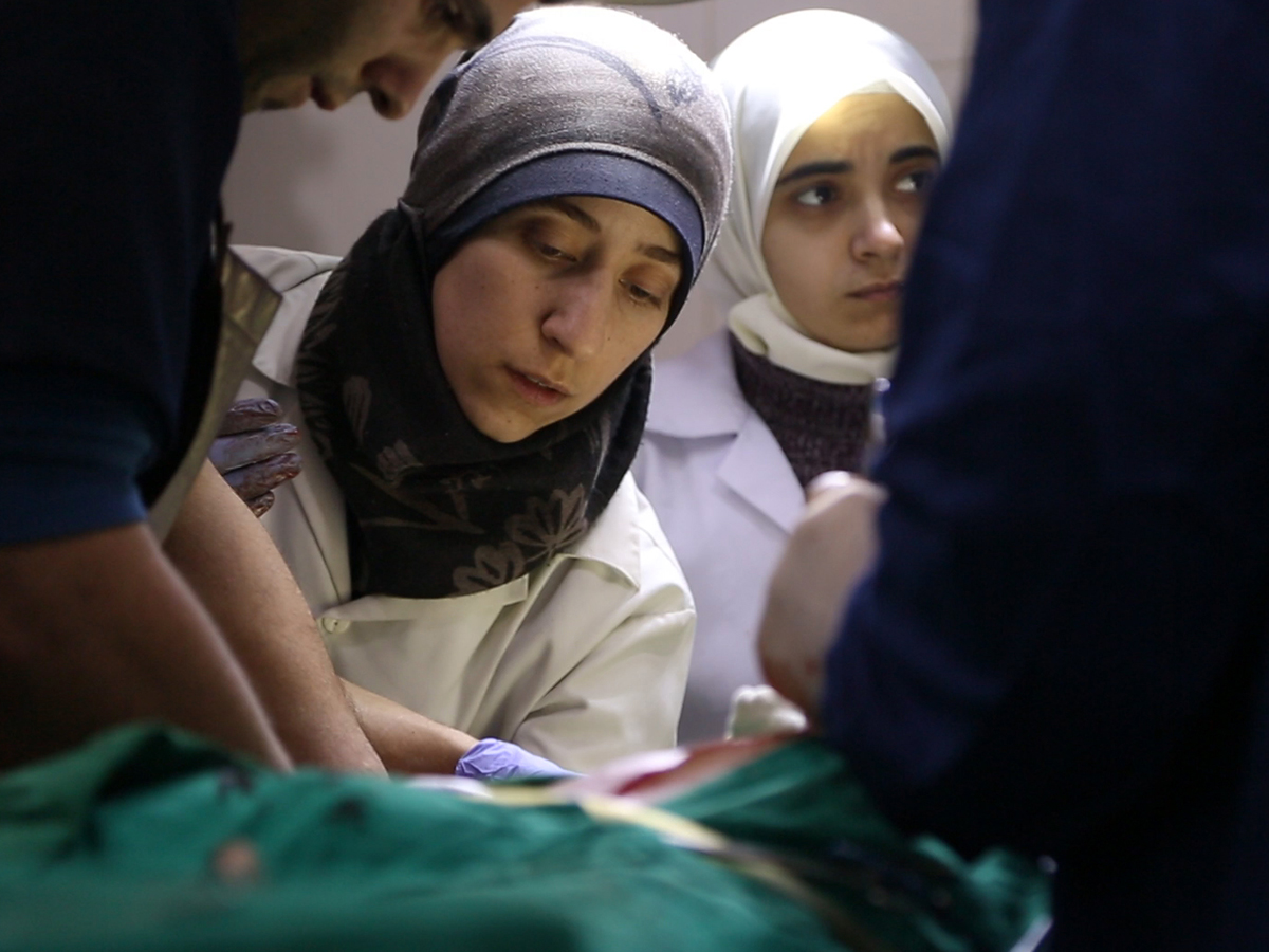 A doctor treats a patient