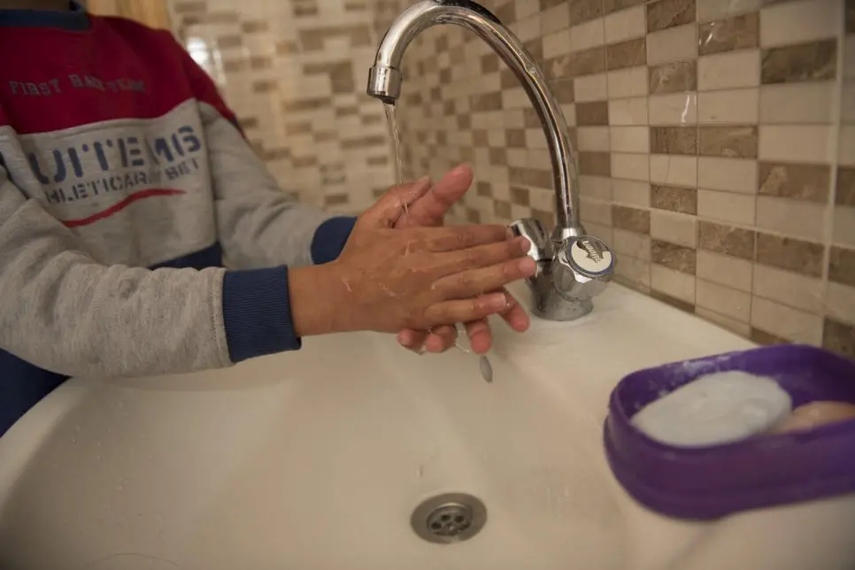 An unidentified child washes their hands with soap and water to prevent the spread of the coronavirus known as COVID-19