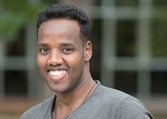 A young man smiling