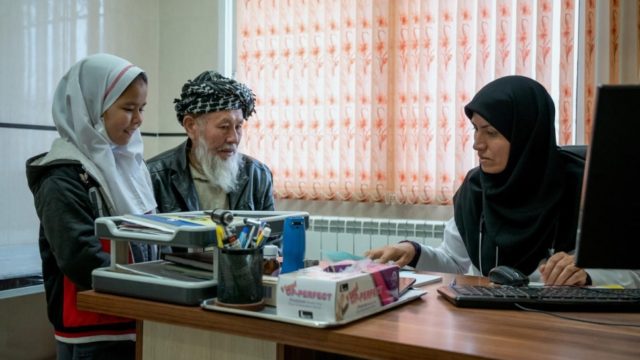 Dr Hosseini with Afghan patients at the Razi health centre. She treats both refugees and Iranians from the local community
