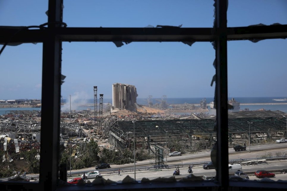 Blast-damaged grain silos stand over the ruined port of Beirut, devastated by an explosion on 4 August