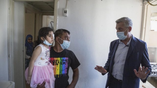 UN High Commissioner for Refugees Filippo Grandi (right) visits the home of Syrian refugee Makhoul Al Hamad in the aftermath of the Beirut Port explosion