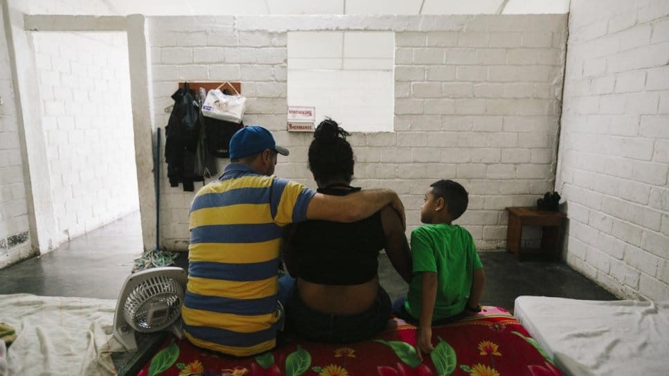 A Central American family awaits a visit with the UN High Commissioner for Refugees at a shelter in Tapachula, Mexico, late last year