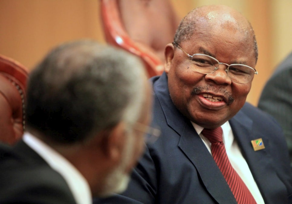 Tanzania’s former President Benjamin Mkapa (right) speaks with Sudan’s Foreign Minister Ali Karti during a meeting in Khartoum, October 11, 2010