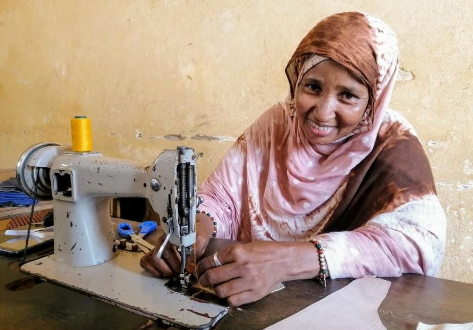 Malian refugees in Niger make face covers to prevent the coronavirus spread