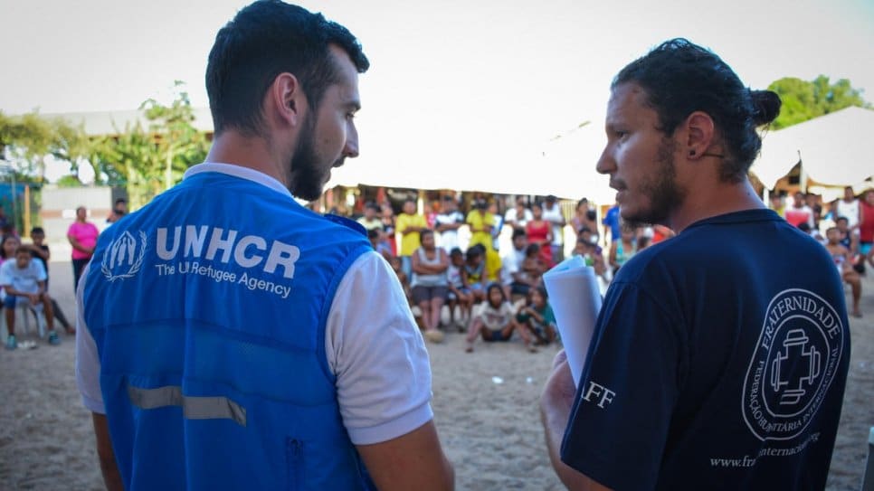 UNHCR staff share COVID-19 preventative health guidelines with indigenous Warao leaders from Venezuela at Pintolandia shelter in Boa Vista, Brazil. The guidelines were translated into Warao