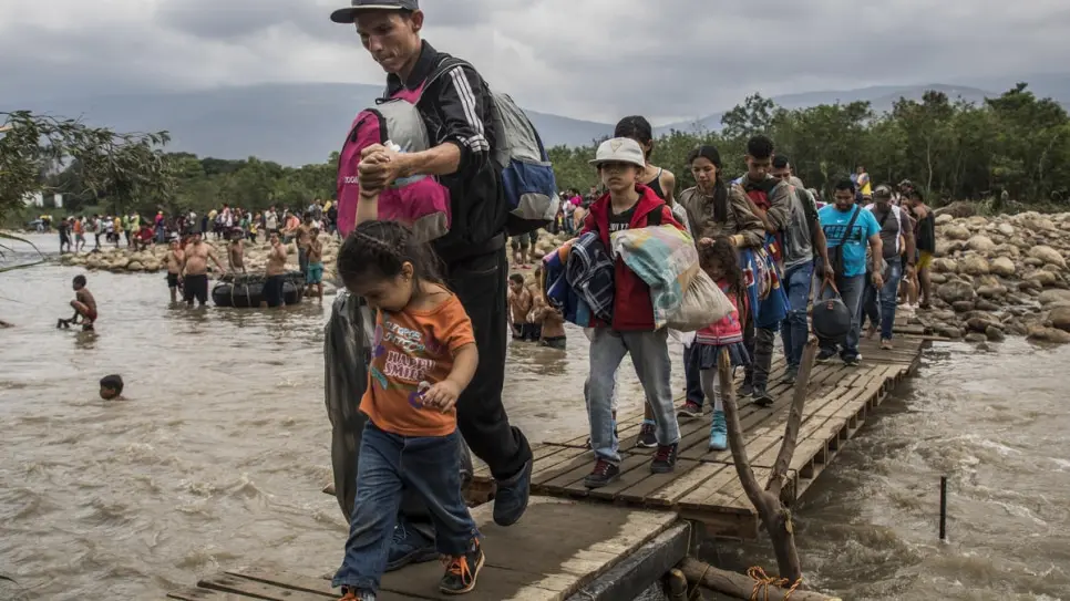 Venezuelans cross the Tachira River to reach Colombia in April 2019