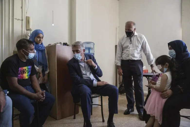 UNHCR High Commissioner Filippo Grandi speaks with Syrian refugee Makhoul Al Hamad, 43, and his daughter Sana, 14, at their home, in the aftermath of the explosion in Beirut, Lebanon, August 19, 2020