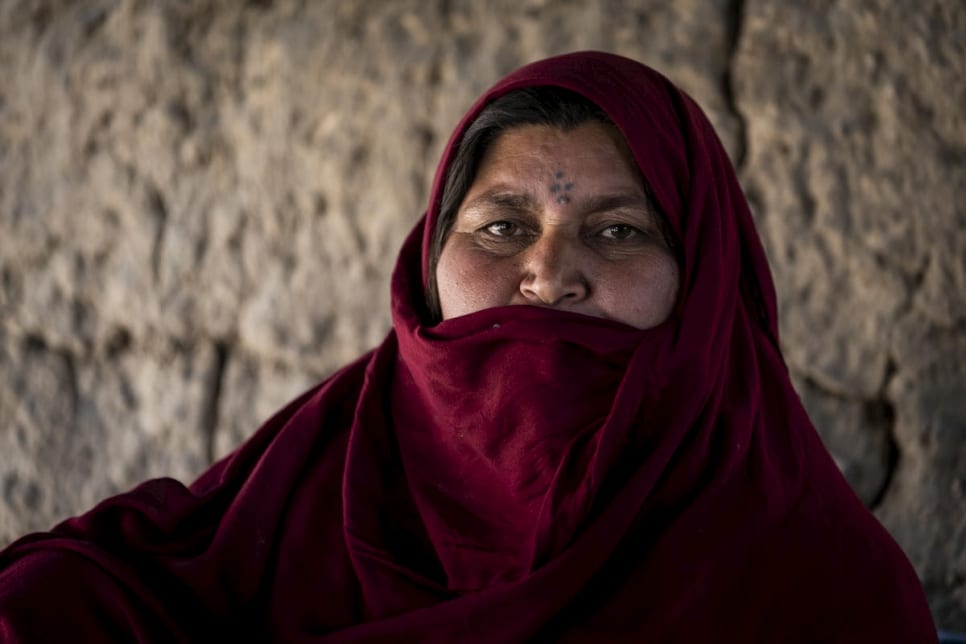 Afghan mother Khatima, 40, a returnee from Pakistan, in her home in Haji Munjai township, Kabul, Afghanistan, July 2019