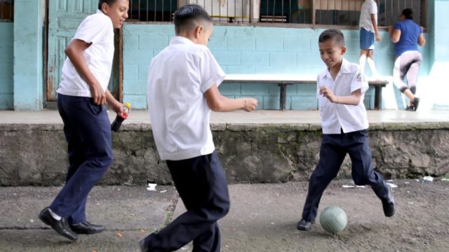Gangs in Honduras prey on vulnerable youths, recruiting them to be used as foot soldiers in their criminal operations. Here, schoolboys are at play in Tegucigalpa in November, 2019