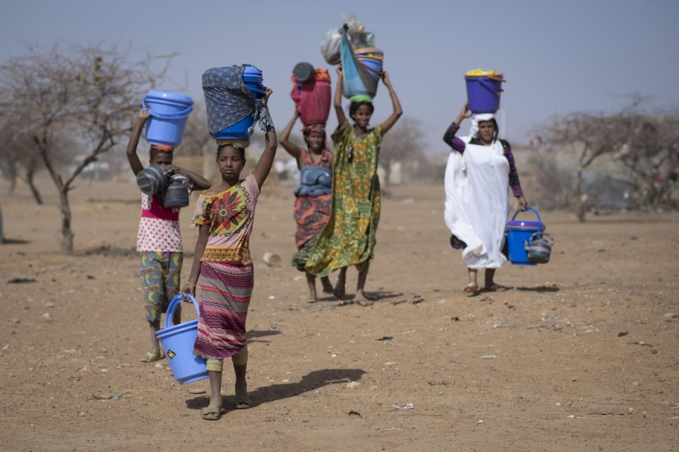 Malian refugees collect aid items at Goudoubo camp, Burkina Faso, February 2020