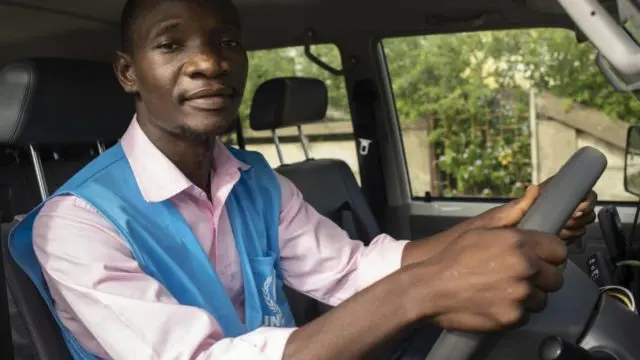 Luis Jose Faife sits in his UNHCR vehicle in Beira, Mozambique